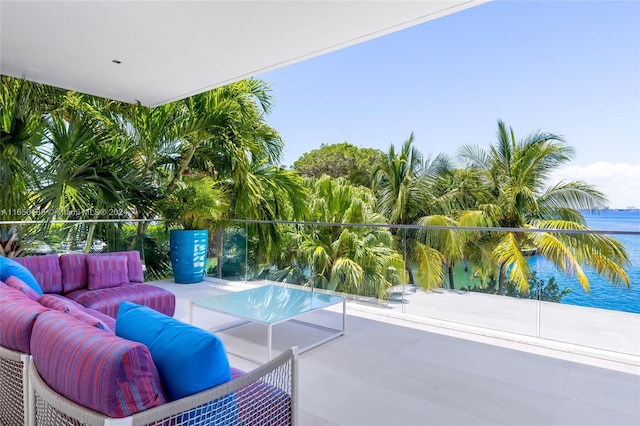 view of patio / terrace with an outdoor living space and a water view