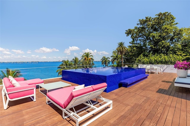 wooden deck featuring a water view