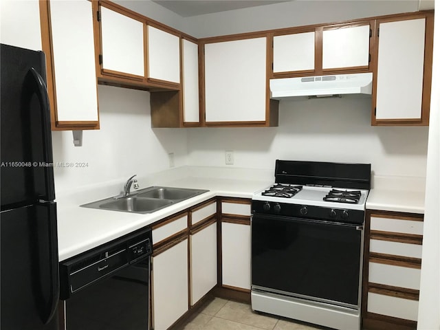 kitchen with black appliances, light tile patterned floors, sink, and white cabinets