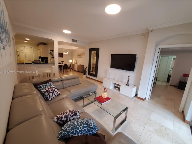 living room with ornamental molding