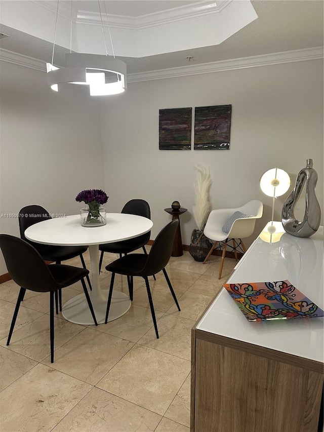 dining area with ornamental molding