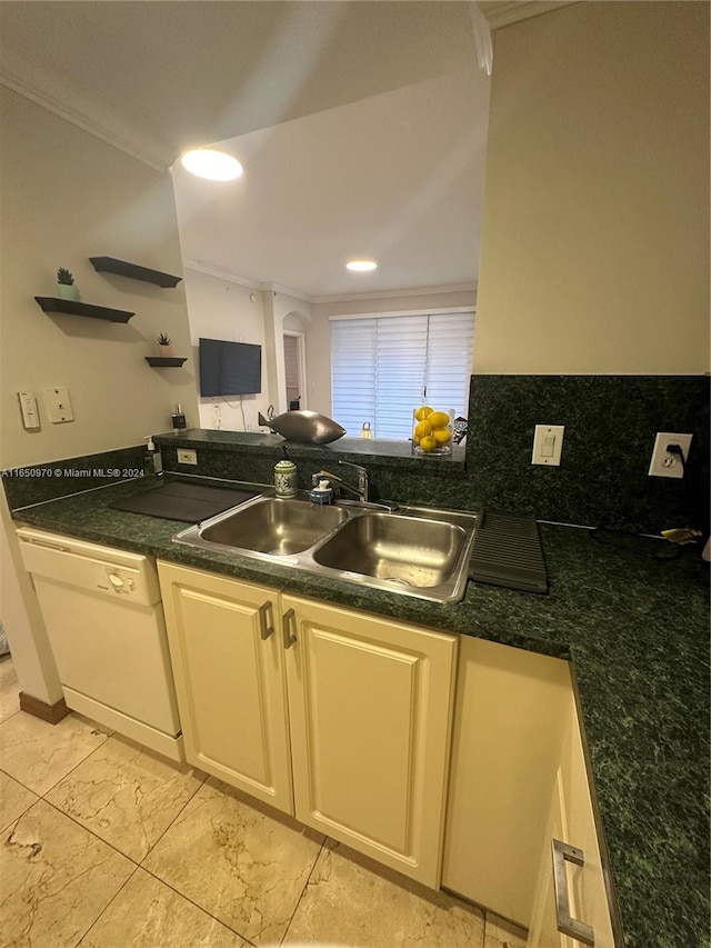 kitchen featuring dishwasher, backsplash, ornamental molding, and sink