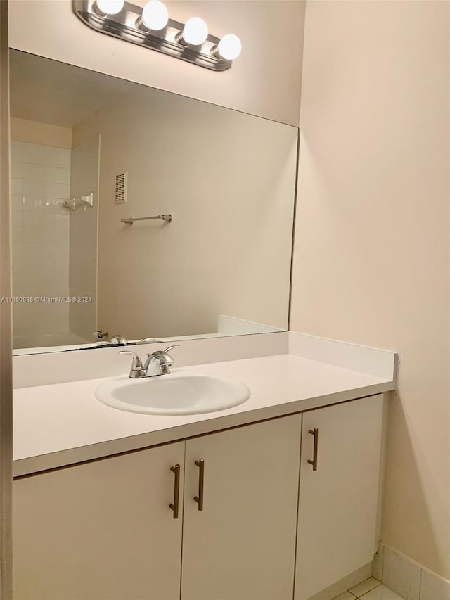 bathroom with vanity and tile patterned floors