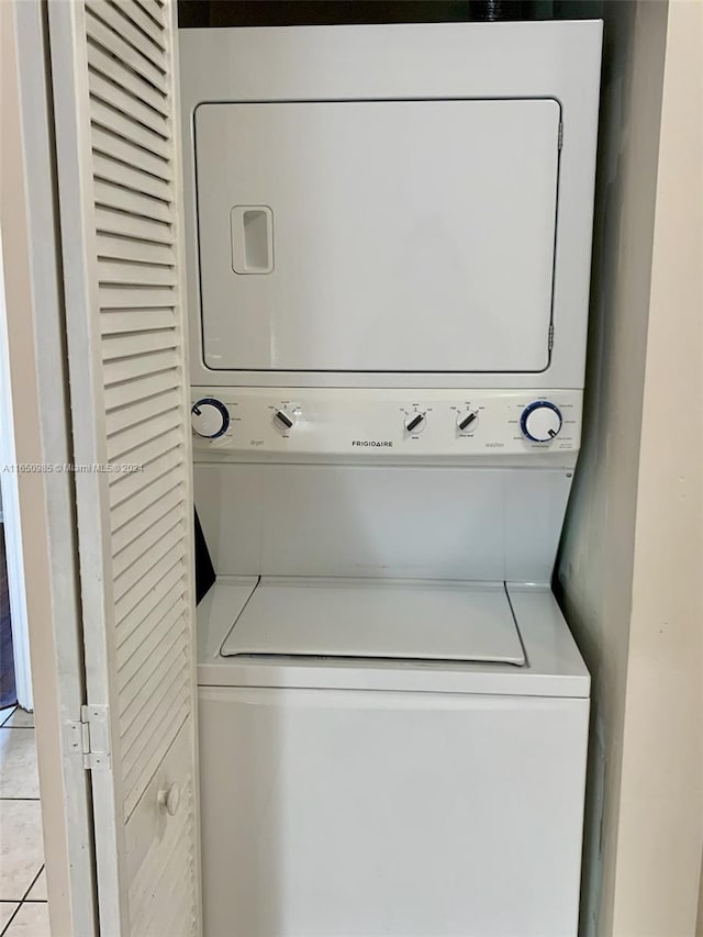 washroom with laundry area and stacked washer / dryer