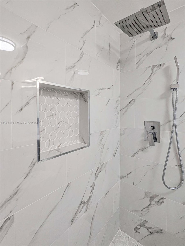 room details with a tile shower