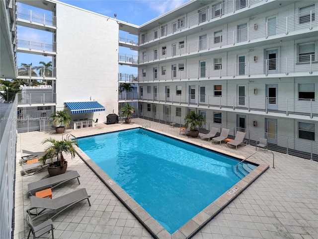 view of pool featuring a patio