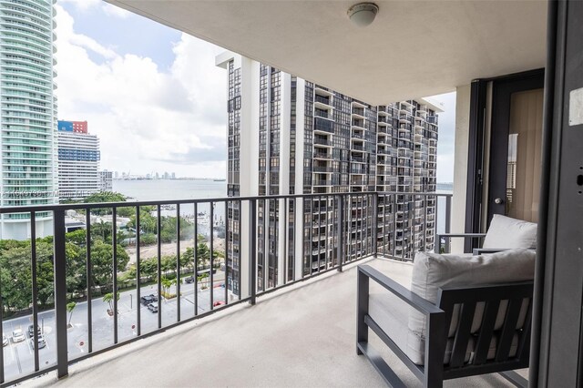 balcony featuring a water view