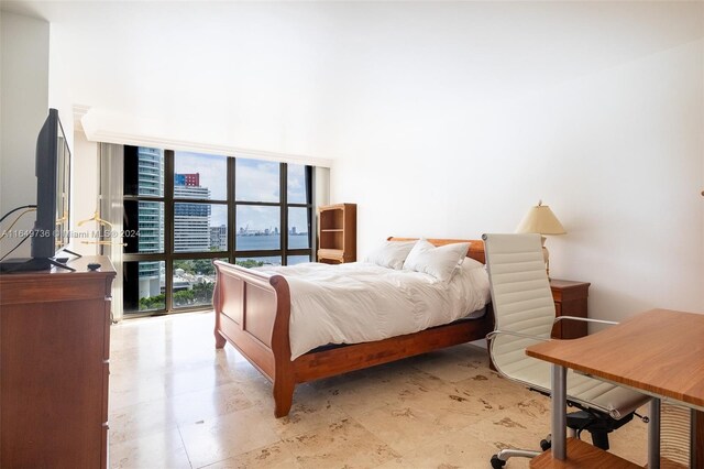 bedroom featuring a water view