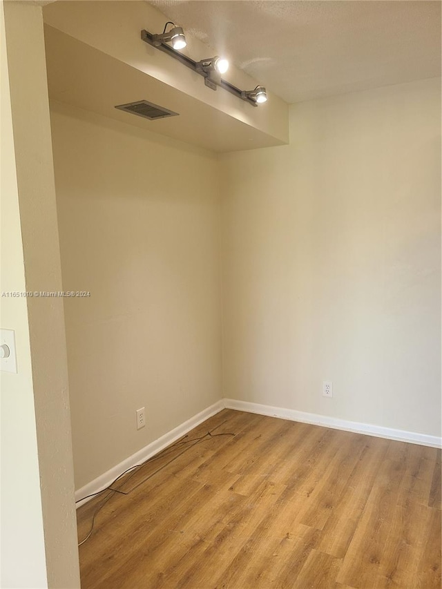 unfurnished room with light hardwood / wood-style floors