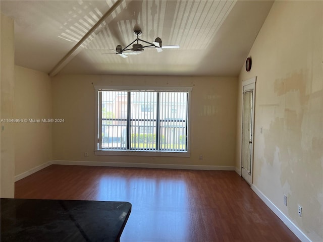 unfurnished room featuring ceiling fan, hardwood / wood-style flooring, and vaulted ceiling