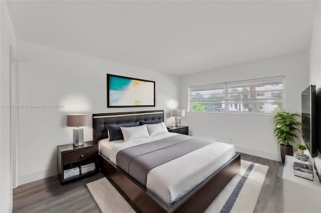 bedroom with wood-type flooring