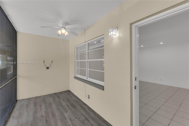 spare room featuring ceiling fan and hardwood / wood-style flooring