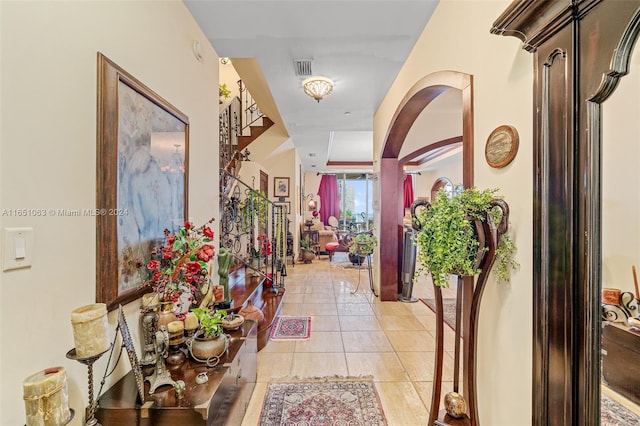 hallway featuring light tile patterned floors