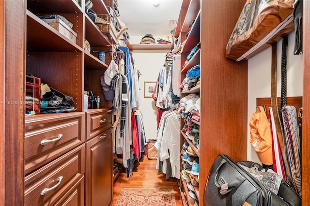 walk in closet featuring light hardwood / wood-style floors