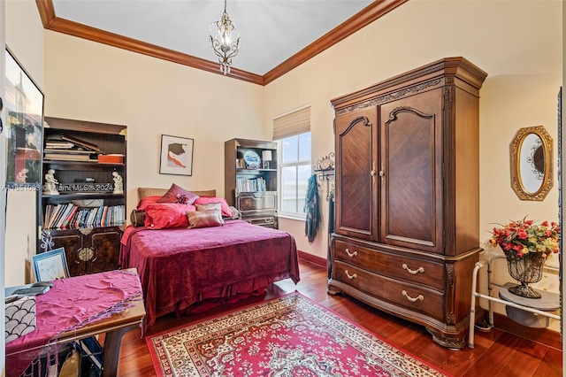 bedroom with hardwood / wood-style flooring and crown molding