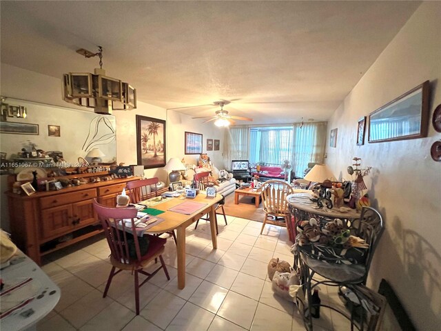 dining room with ceiling fan and light tile patterned floors