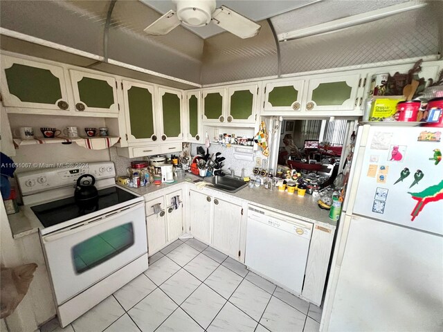 kitchen featuring ceiling fan, sink, white appliances, and white cabinetry