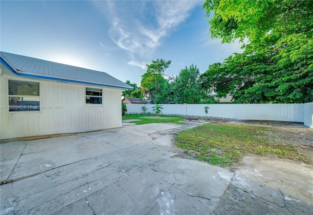 exterior space featuring a patio area and a fenced backyard