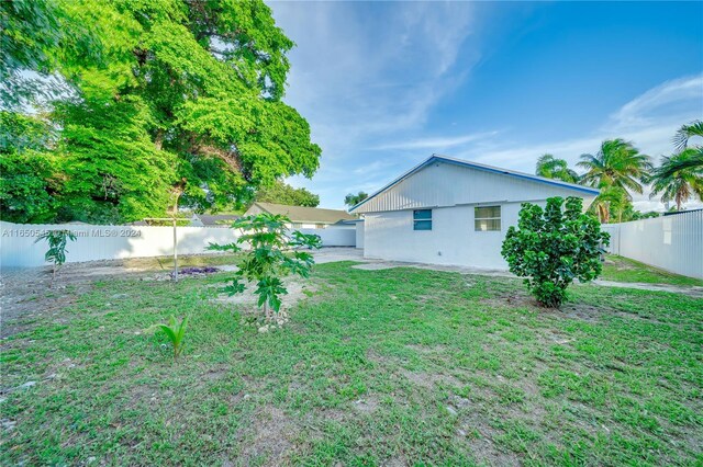 view of yard with a fenced backyard and a patio