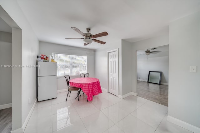 dining room with light hardwood / wood-style flooring and ceiling fan