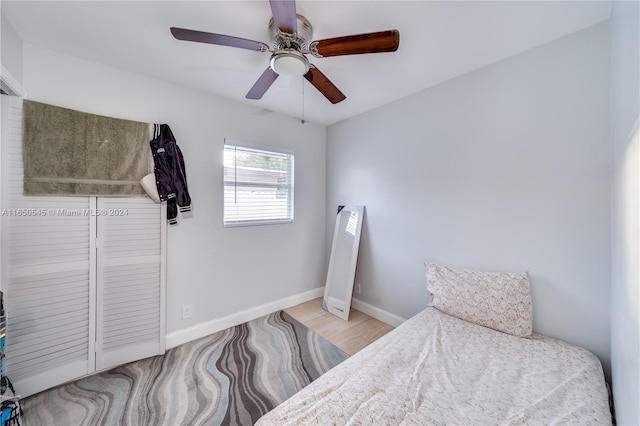 bedroom featuring light wood-type flooring and ceiling fan