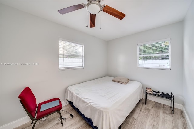 bedroom featuring light wood-type flooring and ceiling fan