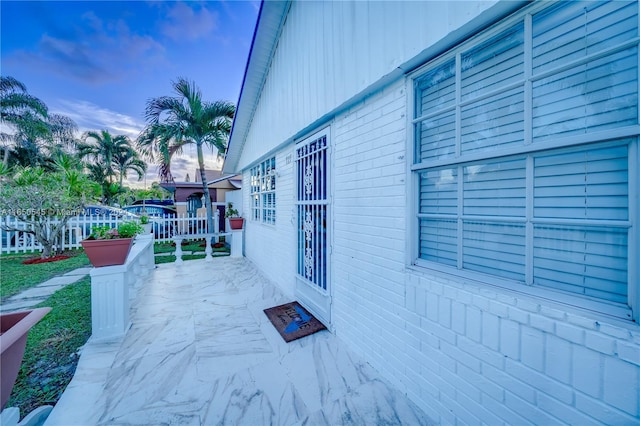 view of patio terrace at dusk