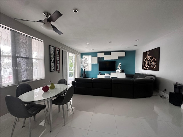 tiled living room with ceiling fan