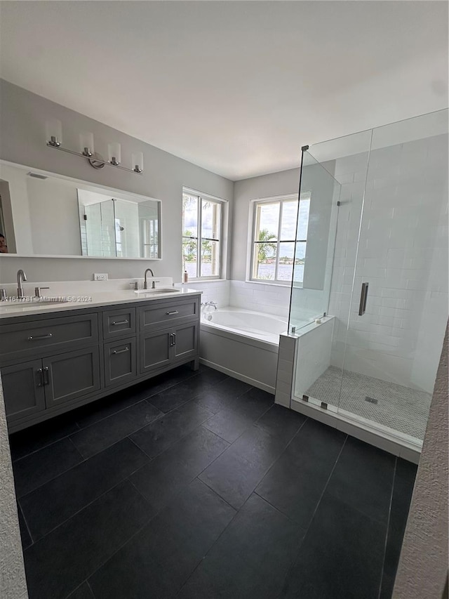 bathroom with vanity, tile patterned floors, and shower with separate bathtub