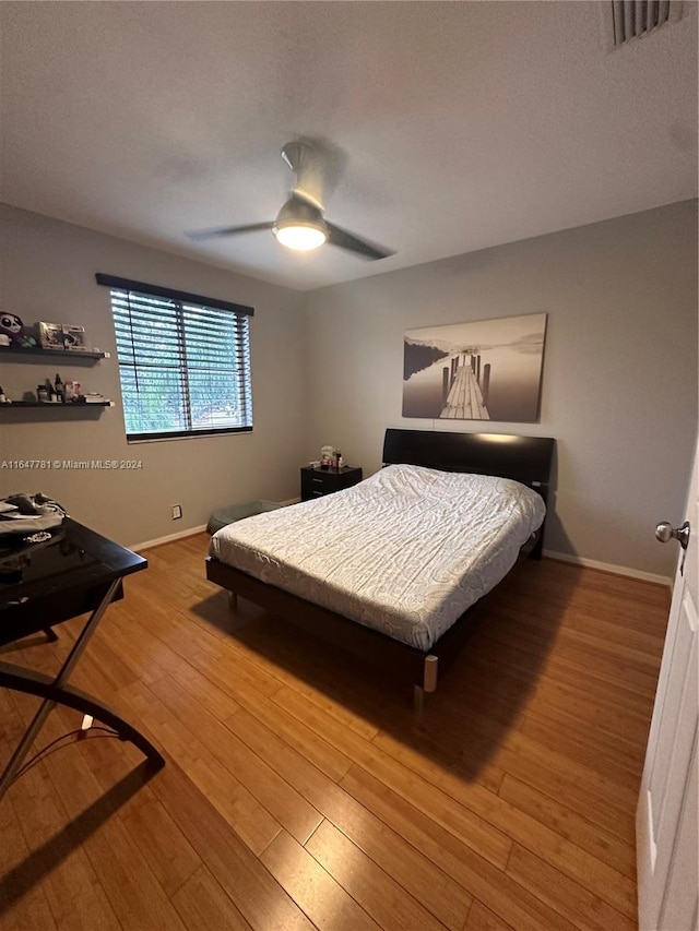 bedroom featuring ceiling fan and wood-type flooring