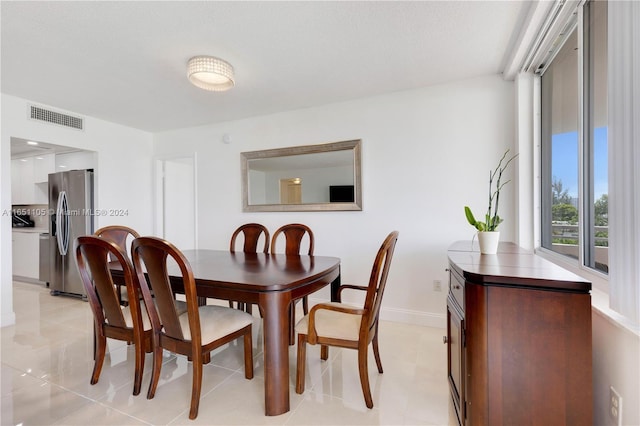 dining area with a textured ceiling