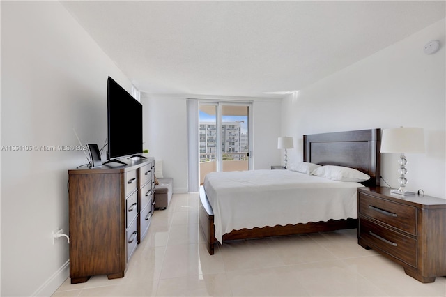 1080 94th St Unit 411, Bay Harbor Islands, FL 33154 - bedroom featuring access to exterior and light tile patterned flooring