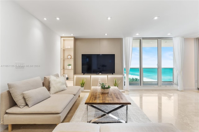 living room featuring floor to ceiling windows