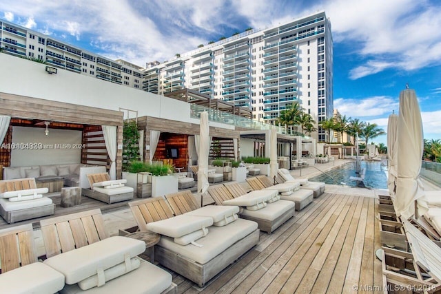 exterior space with a community pool and outdoor lounge area