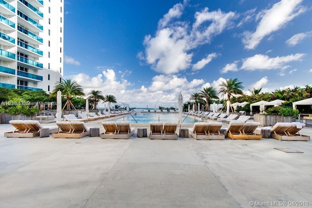 view of pool featuring a water view