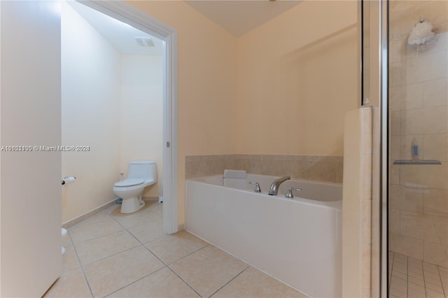 bathroom with tile patterned flooring, independent shower and bath, and toilet