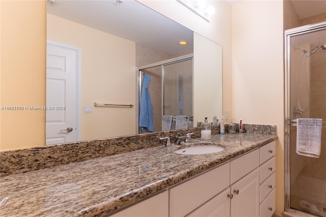 bathroom with vanity and walk in shower