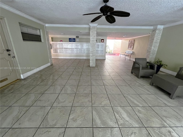 unfurnished living room with ceiling fan, decorative columns, crown molding, and a textured ceiling