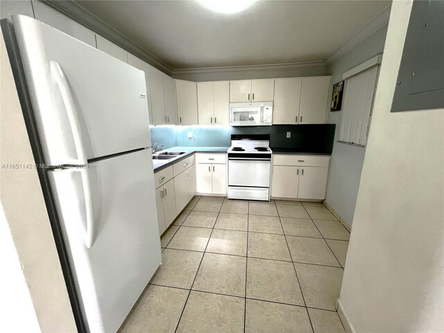 kitchen with white appliances, light tile patterned floors, electric panel, sink, and white cabinets