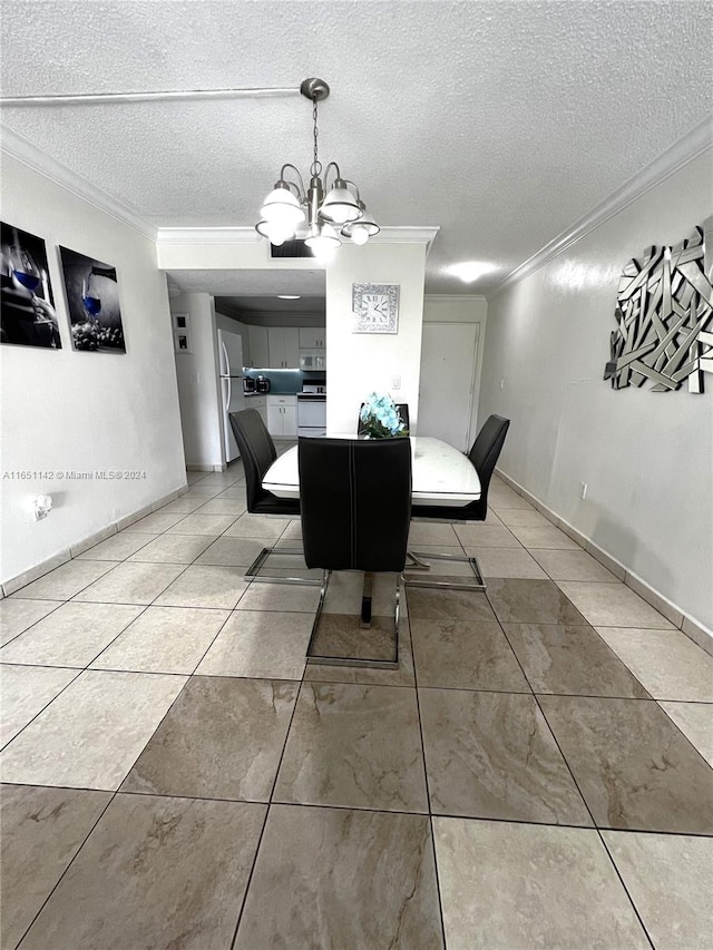 tiled dining space featuring a notable chandelier, a textured ceiling, and ornamental molding