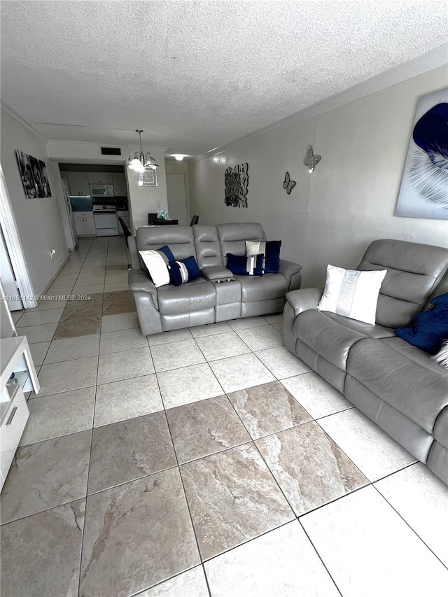 tiled living room featuring a textured ceiling and a chandelier