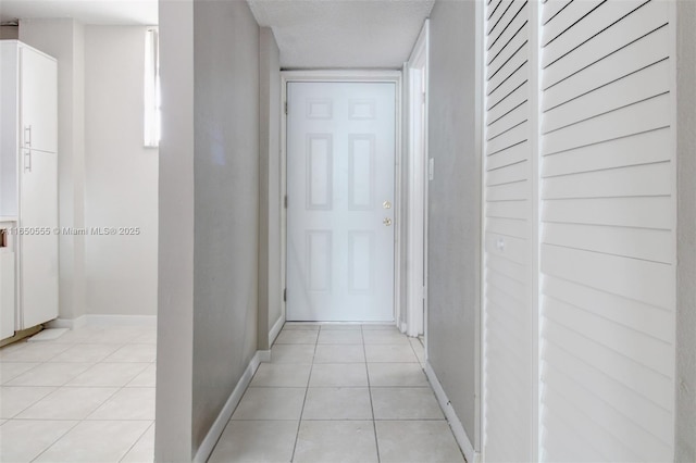 corridor with light tile patterned flooring