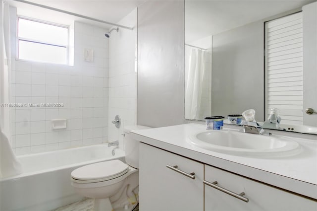 full bathroom with vanity, toilet, and shower / tub combo