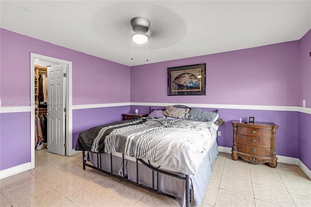 bedroom with ceiling fan and light tile patterned flooring