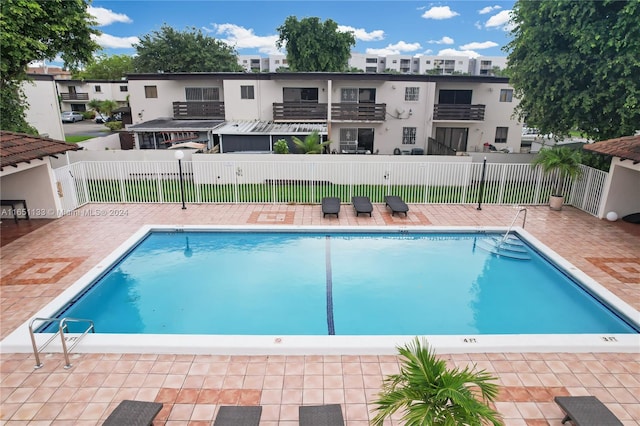 view of pool featuring a patio