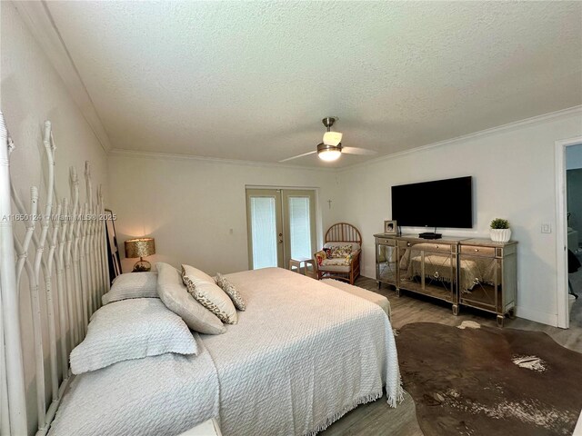 23304 SW 58th Ave Unit B, Boca Raton, FL 33428 - bedroom featuring a textured ceiling, wood finished floors, ornamental molding, a ceiling fan, and french doors