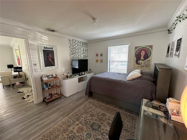 23304 SW 58th Ave Unit B, Boca Raton, FL 33428 - bedroom featuring crown molding, wood finished floors, and a textured ceiling