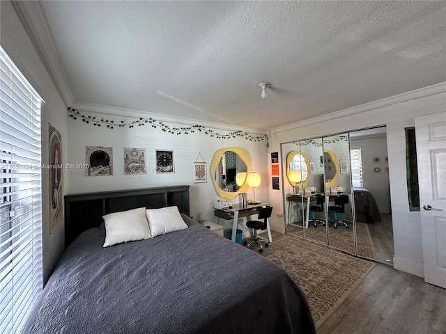 23304 SW 58th Ave Unit B, Boca Raton, FL 33428 - bedroom featuring ornamental molding, a textured ceiling, wood finished floors, an office area, and baseboards