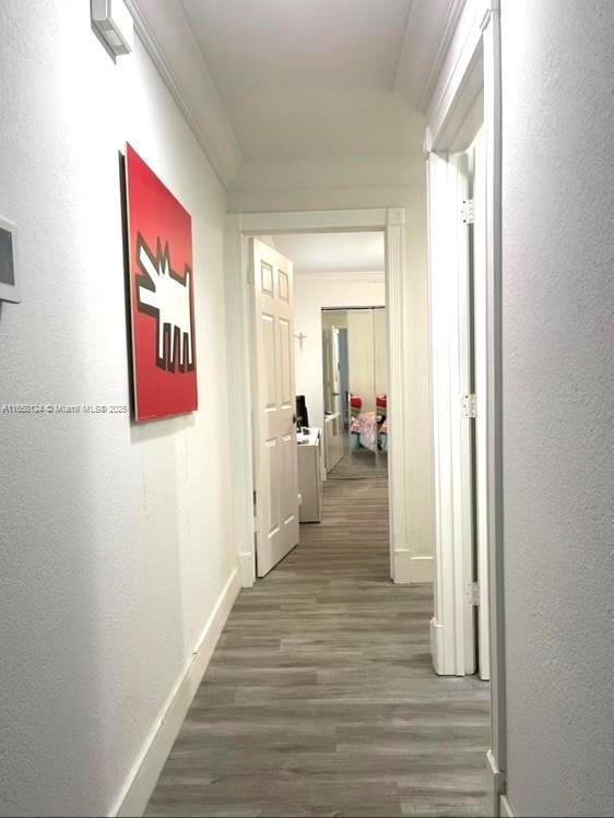 23304 SW 58th Ave Unit B, Boca Raton, FL 33428 - corridor with wood finished floors, baseboards, and a textured wall