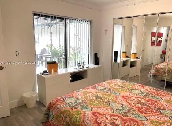 23304 SW 58th Ave Unit B, Boca Raton, FL 33428 - bedroom featuring a closet and wood finished floors